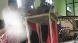 Video viral yang menunjukkan guru SMKN 12 Malang mencekik siswa (Dok. Ist)